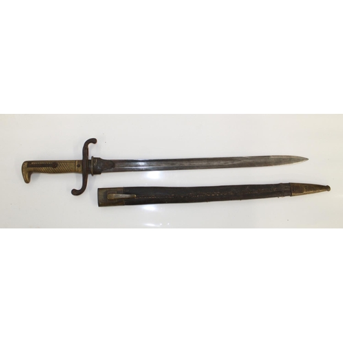 1107 - German imperial bayonet 1871 pattern with brass grip and steel cross guard. Complete with original b... 