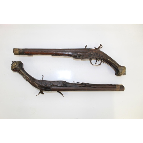 1110 - Pair of circa late 18th century Ottoman flintlock pistols. With decorative engravings to barrels and... 