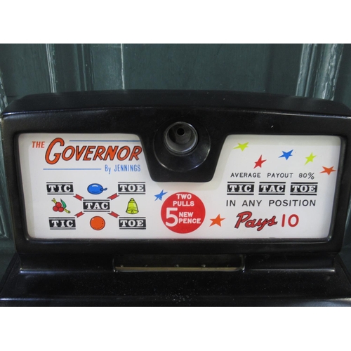 269 - The Governor by Jennings One Armed Bandit Slot Machine, H69cm W44cm D38.5cm, on a oak 2 drawer cabin... 