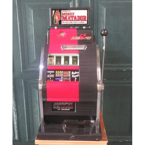 273 - Money Matador One Armed Bandit Slot Machine, H82cm W48.5cm D45cm , in working order, on a oak 2 draw... 