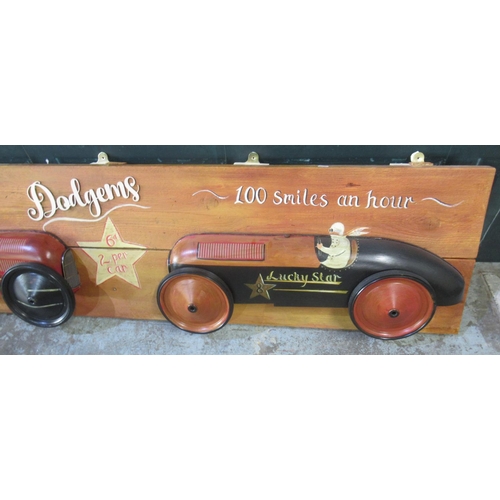 277 - 'No Bumping Dodgems 100 Smiles an Hour' car diorama on 2 plank frame, 180cm x 43.5cm