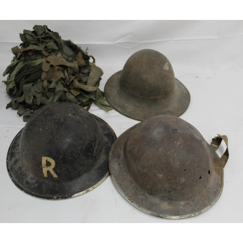 1126 - Collection of four military helmets, comprising two Mk II Brodie helmets, a WW2 Warden's helmet, and... 