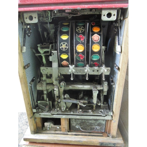 267 - Sega-Bell One Arm Bandit Fruit Machine Slot Machine, H67.3cm W41cm D39.5cm, on a oak single door cab... 