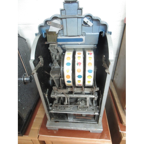 272 - 1930's Mills Extraordinary One Armed Bandit Slot Machine, H72cm  W40cm D40cm, on oak 2 drawer cabine... 