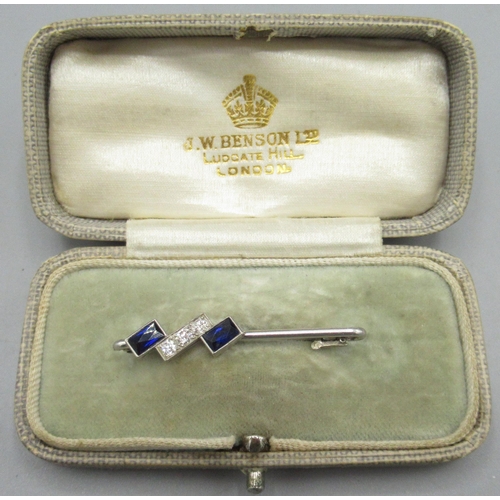 1023 - White metal brooch set with sapphires and diamonds, unmarked, 3.7g