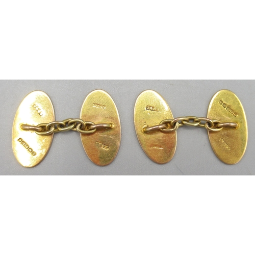 1033 - Pair of 9ct yellow gold cufflinks with engraved foliage detail, and a Victorian 9ct rose gold ring i... 