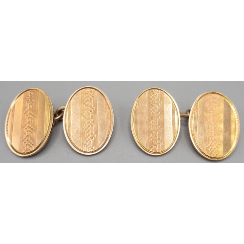 1034 - Pair of 9ct yellow gold cufflinks with engine turned design, stamped 375, 8.2g