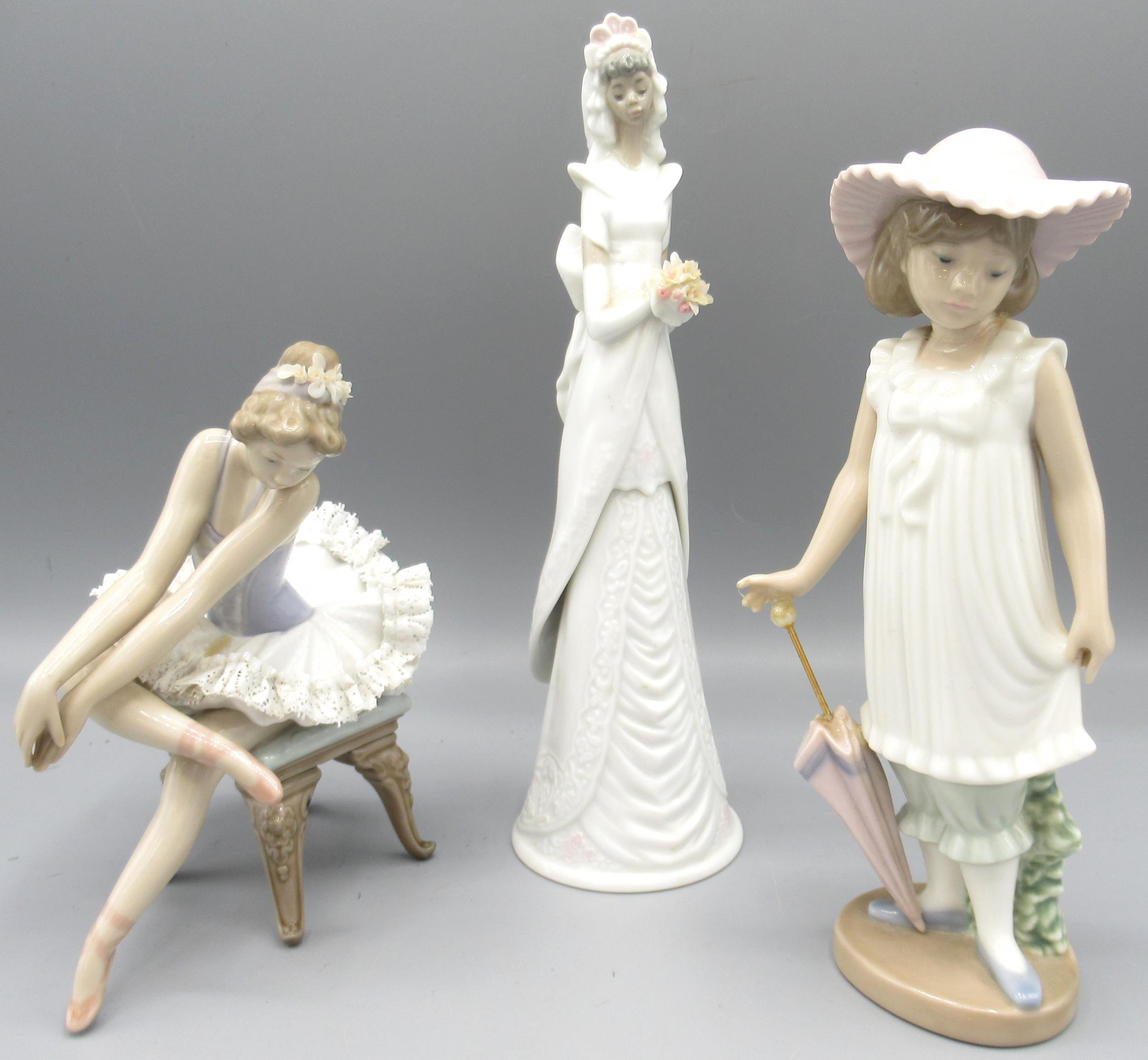 Lladro figure of a seated ballet dancer, H14.5cm; Nao figure of a girl ...