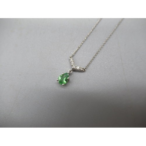 1015 - 18ct white gold drop pendant set with green stone and diamond, stamped 750, 2.1g and a 9ct yellow go... 