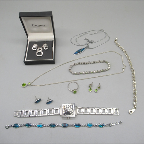 1016 - Silver drop pendant necklace set with green stones, matching earrings and ring, and a similar bracel... 