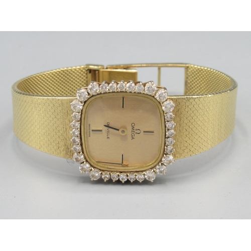 1285 - Ladies Omega De Ville gold and diamond set wristwatch on integrated fine mesh tapering bracelet hall...