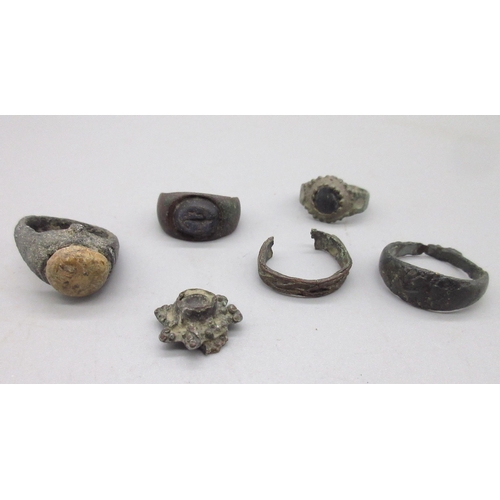 123 - Bronze Roman ring set with cabochon beige stone (approx. C2nd AD), another bronze Roman ring set wit... 