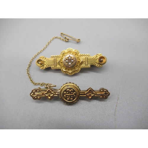 1005 - Two Victorian 9ct yellow gold Etruscan style bar brooches, one set with seed pearls, both stamped 37... 