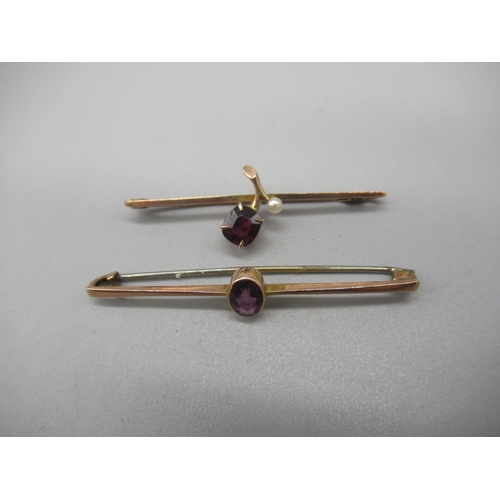 1009 - 9ct yellow gold bar brooch set with purple stone, and another similar set with red stone, both stamp... 