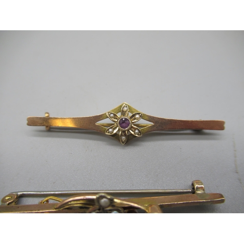 1010 - Yellow metal bar brooch set with amethyst and seed pearl floral cluster, and another yellow metal ba... 