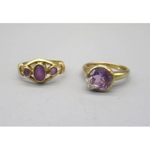 1018 - 9ct yellow gold ring set with three purple stones, size N, and another 9ct gold ring set with purple... 