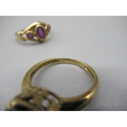 1018 - 9ct yellow gold ring set with three purple stones, size N, and another 9ct gold ring set with purple... 