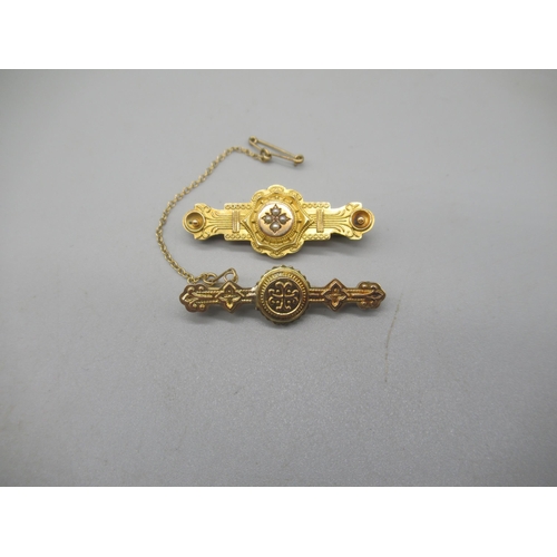 1005 - Two Victorian 9ct yellow gold Etruscan style bar brooches, one set with seed pearls, both stamped 37... 