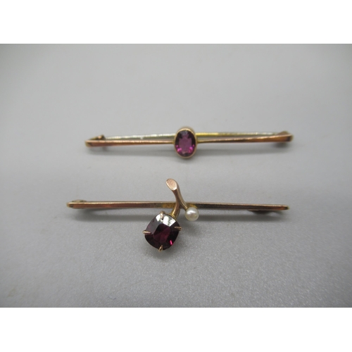 1009 - 9ct yellow gold bar brooch set with purple stone, and another similar set with red stone, both stamp... 