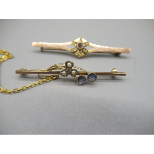 1010 - Yellow metal bar brooch set with amethyst and seed pearl floral cluster, and another yellow metal ba... 