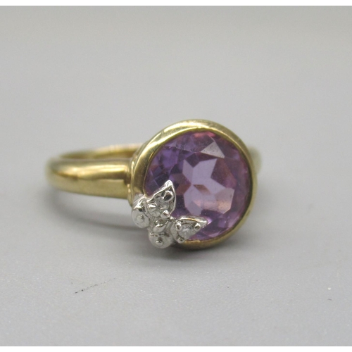 1018 - 9ct yellow gold ring set with three purple stones, size N, and another 9ct gold ring set with purple... 