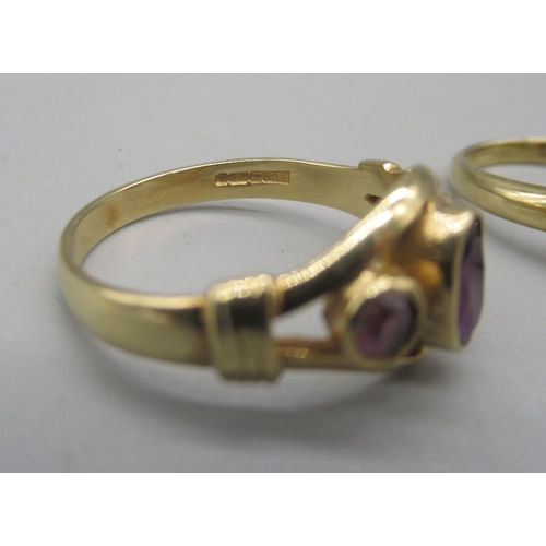 1018 - 9ct yellow gold ring set with three purple stones, size N, and another 9ct gold ring set with purple... 