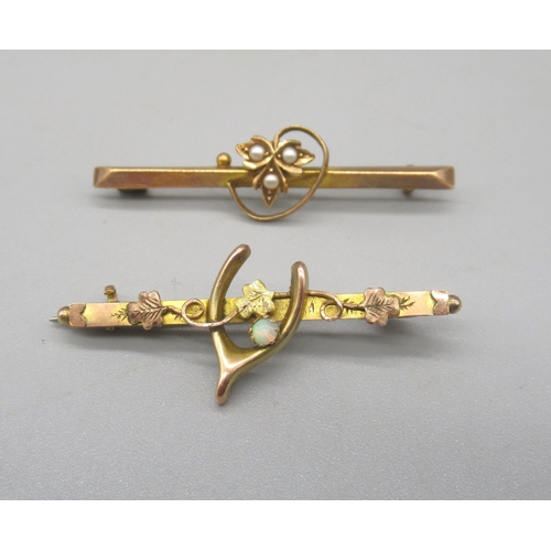 1644 - 9ct yellow gold brooch set with single pearl and wishbone design, stamped 375, and a 15ct gold brooc... 