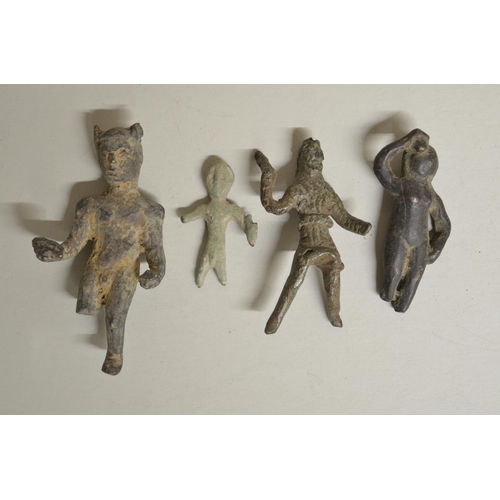 248 - Collection of historical cast metal figures including a Celtic bronze figure holding a Dolphin (with... 