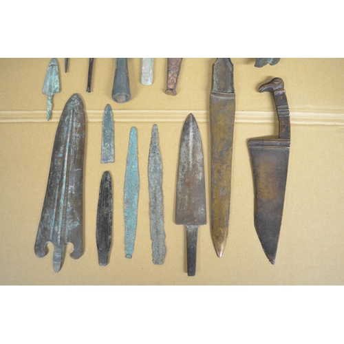 283 - Collection of ancient Greek and Roman copper and bronze knives, spear and arrow heads, a double head... 