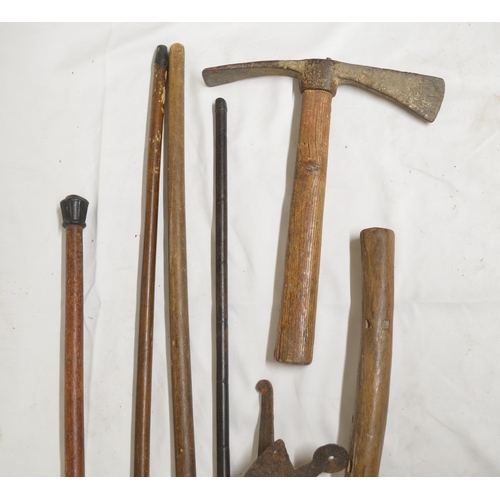 290 - Collection of vintage tools and walking sticks to include a hoe, fireman's axe etc. (Victor Brox col... 