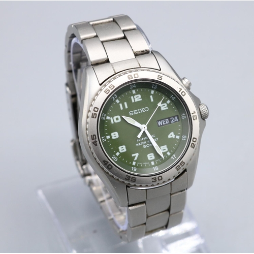 1093 - Seiko Kinetic 50M stainless steel wristwatch with day date on matching bracelet, signed green Arabic... 