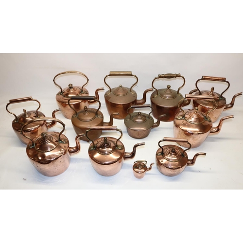 1164 - Twelve Victorian copper kettles all with acorn & mushroom finials, H30.5cm (2)