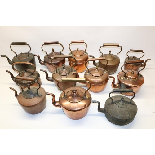 1165 - Twelve Victorian copper kettles all with acorn and mushroom finials, H30cm (2)