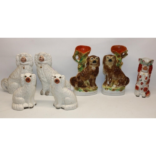 1290 - Two pairs of white Staffordshire style pottery mantle dogs, a similar jug in the form of a begging s... 