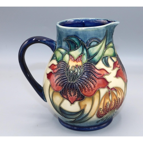 1616 - Moorcroft Pottery, Anna Lily pattern jug, designed by Nicola Slaney, H15cm