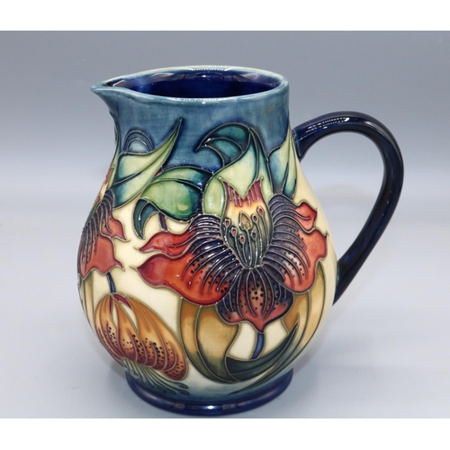 1616 - Moorcroft Pottery, Anna Lily pattern jug, designed by Nicola Slaney, H15cm