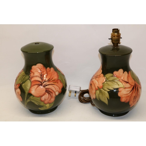 1628 - Pair of Moorcroft Pottery Hibiscus pattern table lamps, H25cm (2)