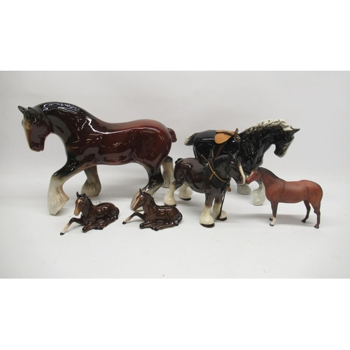 1062 - Two Beswick horses No. 915, a Royal Doulton horse and three other large ceramic shire horses (6)