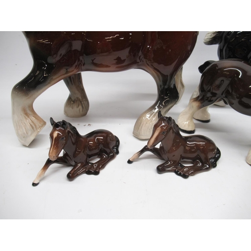 1062 - Two Beswick horses No. 915, a Royal Doulton horse and three other large ceramic shire horses (6)