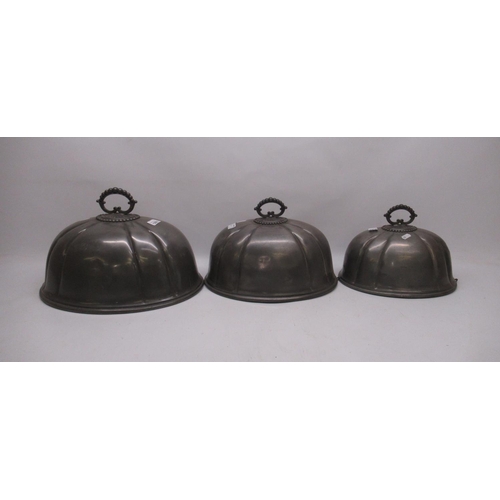 1209 - Three pewter graduated meat covers W41cm