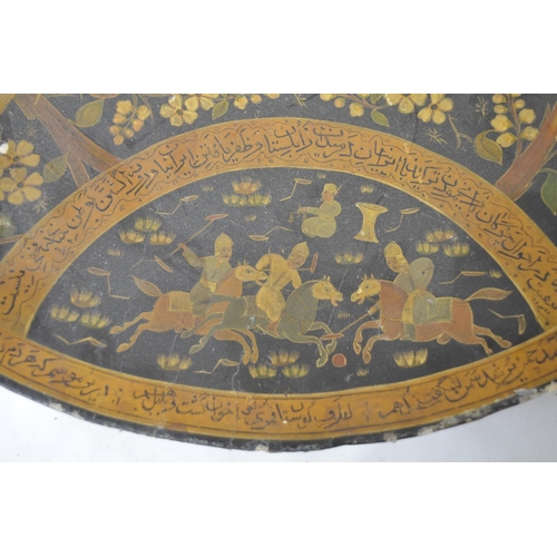 229 - Indo-Persian papier mache raised charger with painted scenes depicting hunting, animals, games and w... 