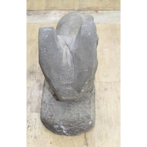 296 - Carved stone figure of a seated horned animal. ( 31cm high (Victor Brox collection)