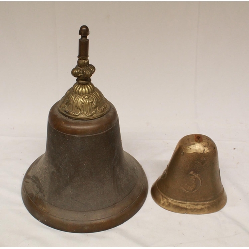 84 - Large brass bell with ornate headstock, lacking original clapper, and a small brass bell casing, max... 