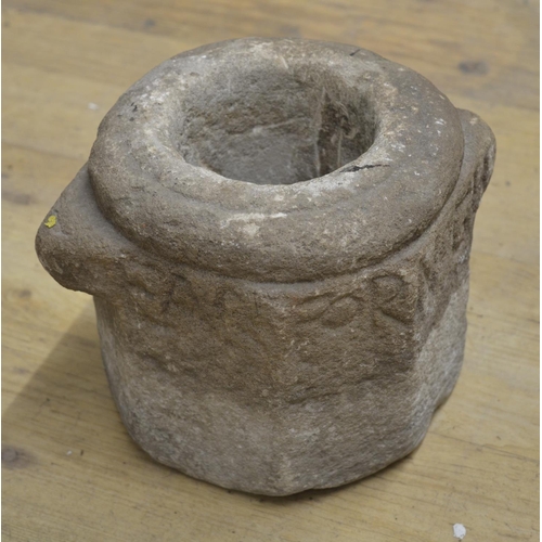 28 - Carved stone mortar with lettering to the upper sides W24xD18xH27.5cm and a circular domed millstone... 