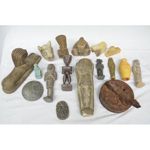 77 - Collection of mostly Egyptian stone and clay figures, mostly modern. Also a small grindstone with ca... 