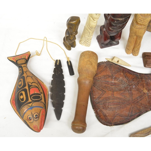 78 - Collection of ethnic art and decorative items including a North American Haida tribal fish rattle, a... 