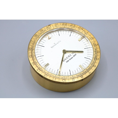 1374 - Tiffany & Co, a gilt brass World Time desk clock, with text to face 'Gucci IPO 24th October 1995', D... 