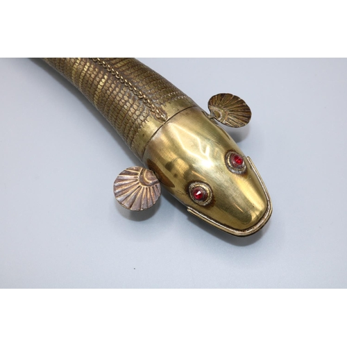 1634 - Early 20th century articulated brass Indian Medina style fish, red paste eyes, L23.5cm