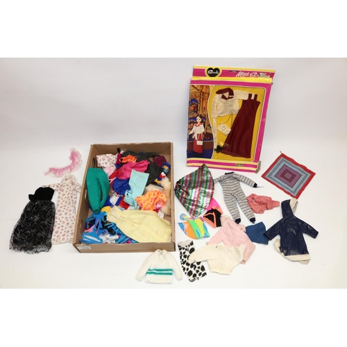 1710 - Boxed Miss Sindy evening outfit, and a large collection of vintage and modern dolls clothes, includi... 