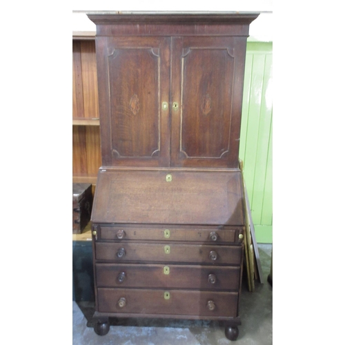 1187 - C18th oak bureau bookcase, the top with two inlaid panel doors, fitted interior with concealed well ... 